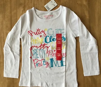 Buy Girls Ivory Long Sleeve T Shirt With Pretty Cute, Clever, Cool, Perfect, Me  • 5.99£
