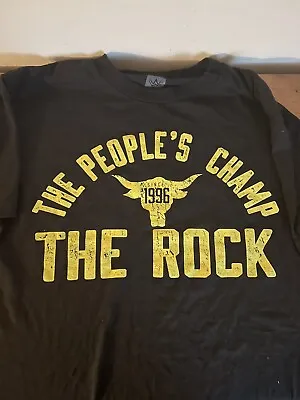 Buy WWE The Rock -The People’s Champion Bringing It For 20 Years T-Shirt (M) • 25£