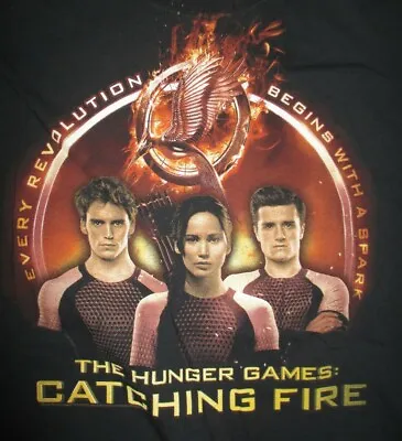 Buy Every Evolution Begins With A Spark THE HUNGER GAMES - CATCHING FIRE (LG) Shirt • 18.90£
